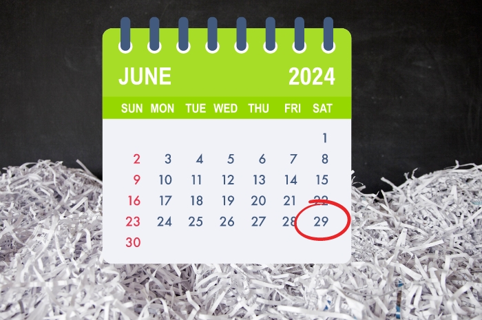 shredded paper and calendar with June 29th circled