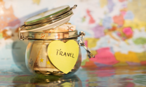 jar of money labeled 'Travel'