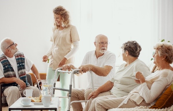 Elders spending time together in the common room of a care home