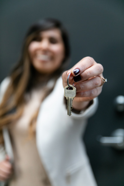 smiling woman with new house keys