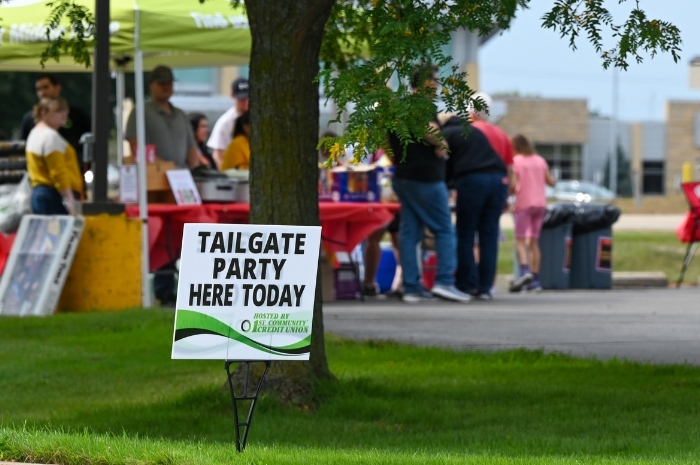 a group of members enjoying a tailgate celebration at a credit union