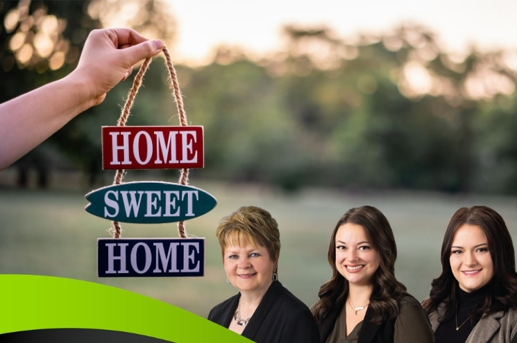 hand holding Home Sweet Home sign