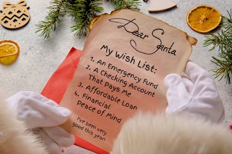 Santa hands holding a year-end wish list