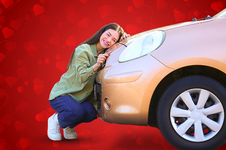 young woman hugging a car and hearts in the background