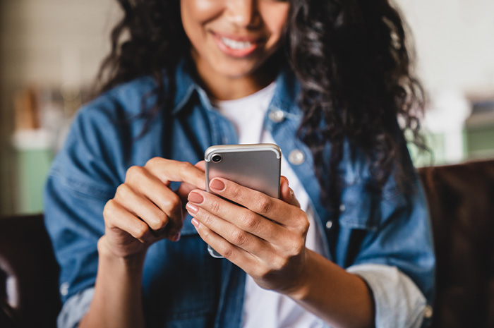 closeup of woman looking at something on her smart phone