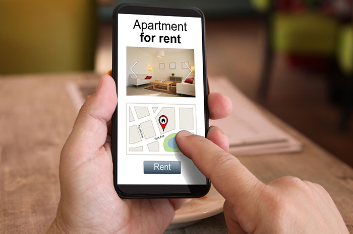 smart phone showing a rental apartment listing