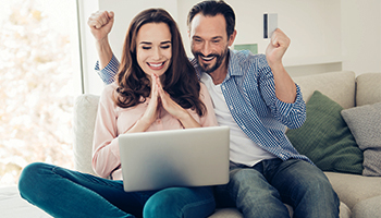 Couple looking at laptop